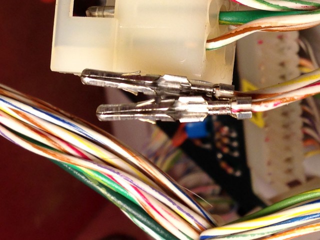 Crimp pin was installed incorrectly at the factory. The wire was inserted too far and the crimp went around the insulation rather than the conductor.